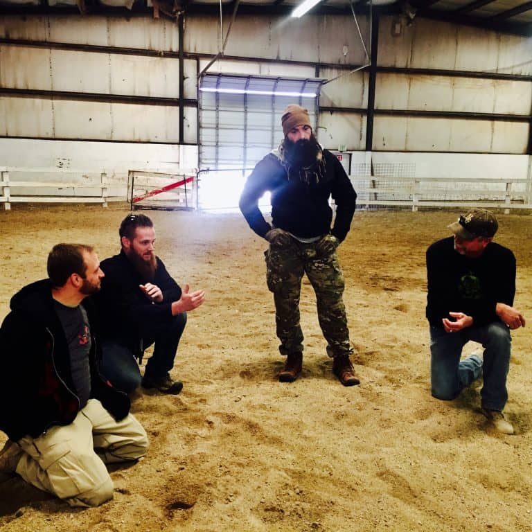 Guys talking in arena