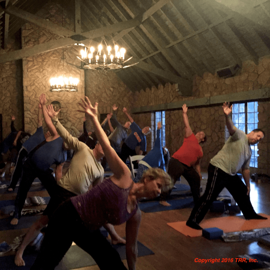 A Group of people doing yoga